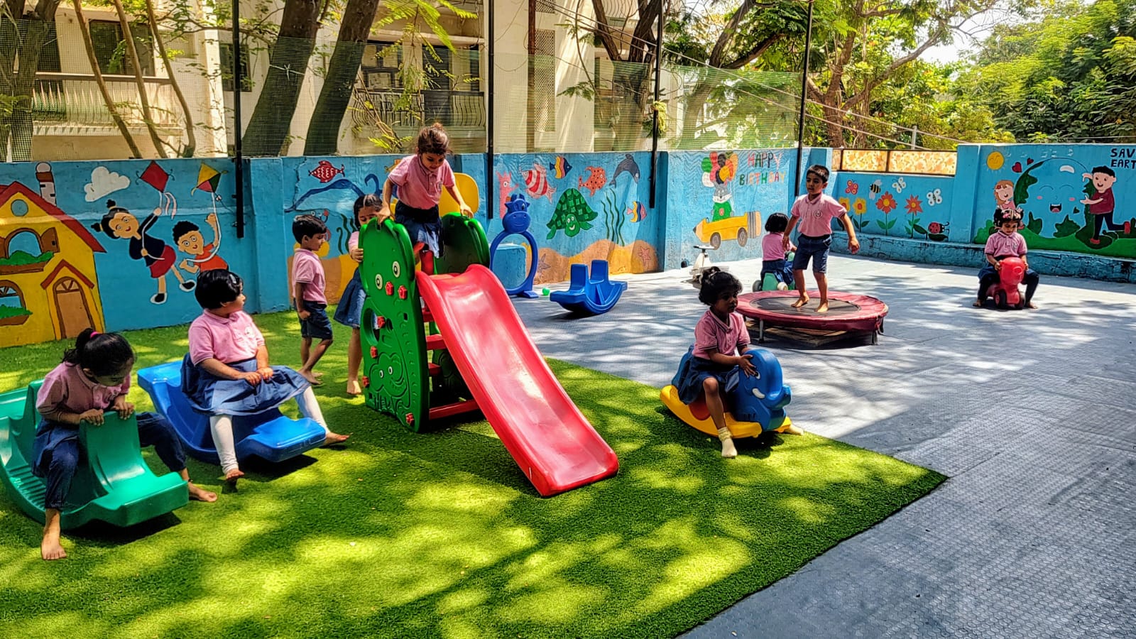 Children enjoying the outdoor adventure playground at Tag Play School Masab Tank